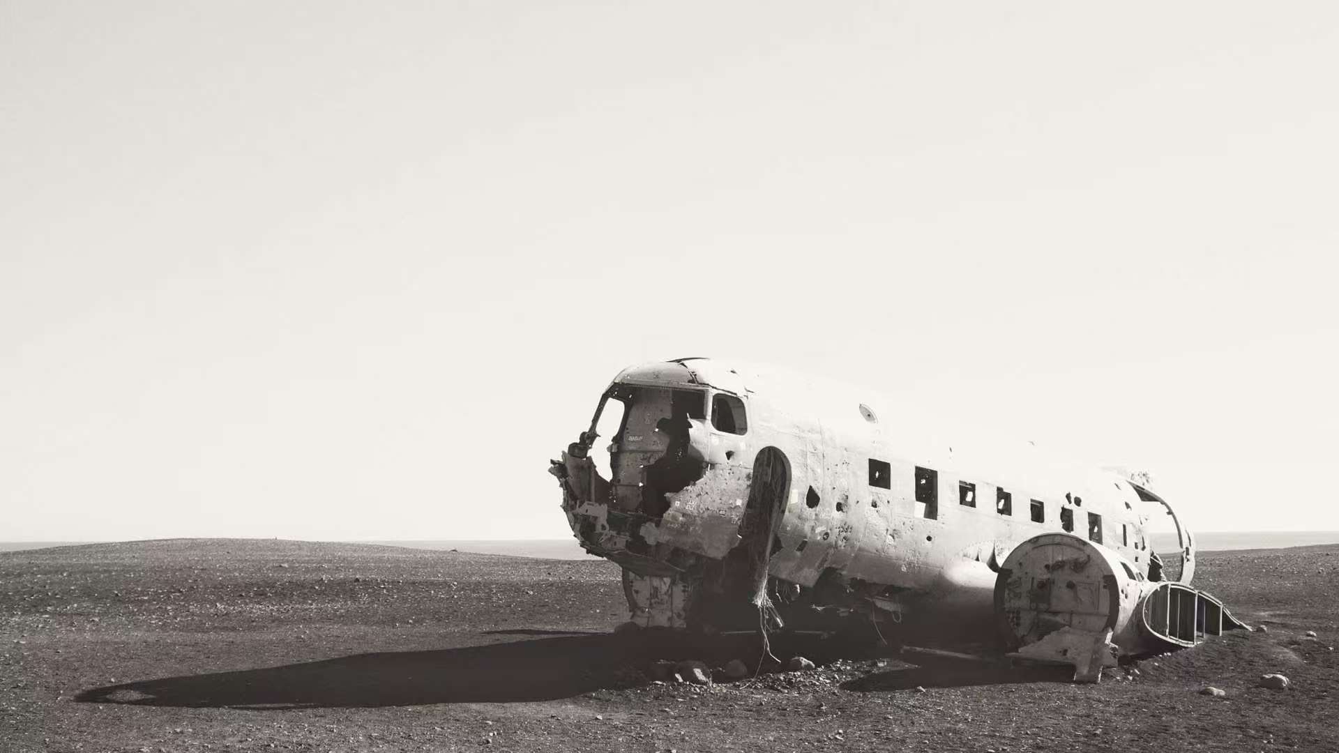 Abandoned plane wreck in a barren landscape