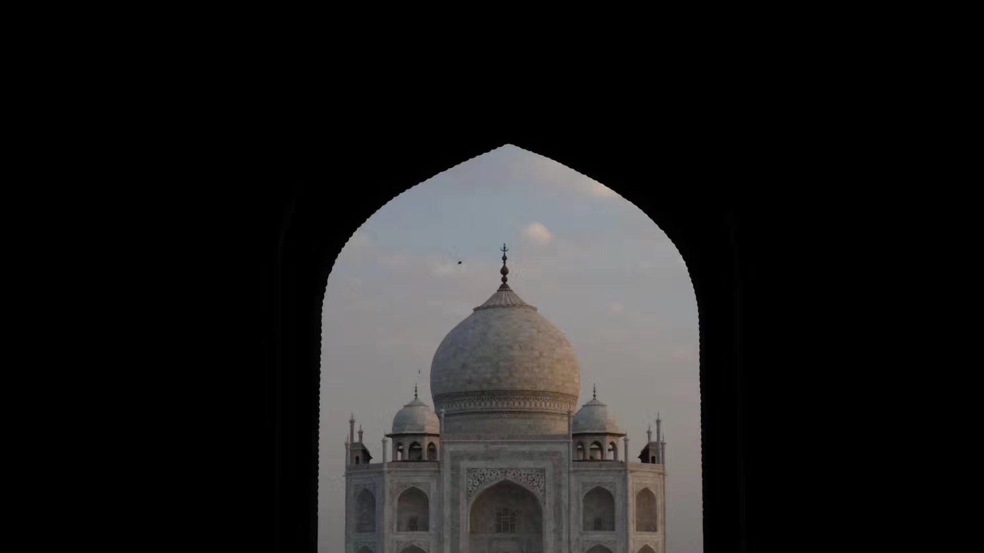 Monument framed by a dark arch